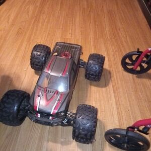 Black and Red Monster Truck with Oversized Wheels